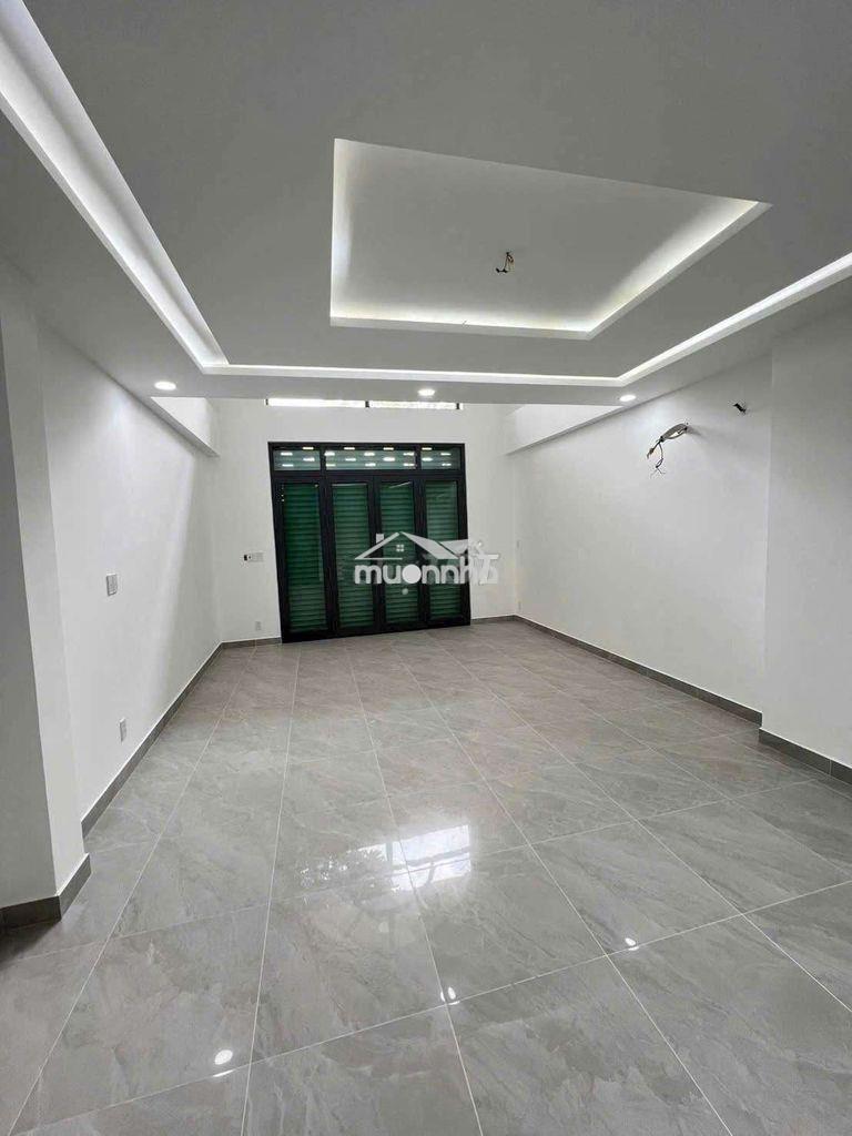 Nhà mới xe hơi đậu  cửa huỳnh văn bánh_ tiện ở + kinh doanh