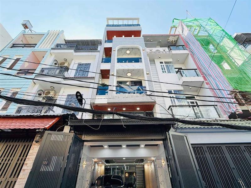 Nhà nguyên căn trệt lửng 4 lầu có 5pn có thang máy 450ky hẻm 8m 1 trục